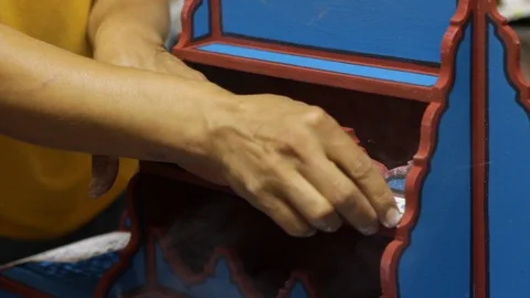 The Moroccan is making some decoration to his multicolor woodwork art Stock Footage 124064571