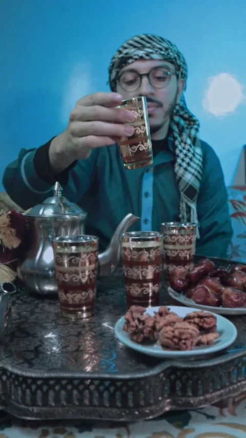 Moroccan man eating and drinking tea Stock Footage 303966780