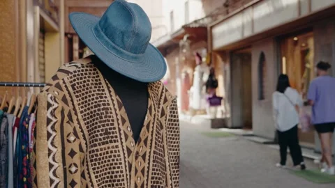 Moroccan Market: Mannequin with Patterned Jacket and Denim Hat Stock Footage 346044330