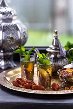 Moroccan Mint Green Tea in Two Glasses and a Teapot With Fresh Mint and Stock Photos