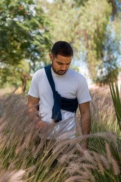 Moroccan model in the middle Marram Grass field in a public park Stock Photos