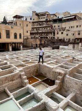 Moroccan model posing in the middle of Chouara tannery in the old medina of Fez Stock Photos