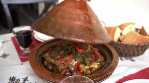 Moroccan Poolside Dining Setup with Traditional Tagine and Decor May 29,2025 Video stock 310320348