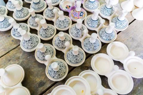 A moroccan pottery maker creates ceramics in a workshop in old medina of Fez, Stock Photos