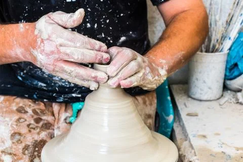A moroccan pottery maker creates ceramics in a workshop in old medina of Fez, Stock Photos