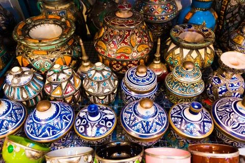 A moroccan pottery maker creates ceramics in a workshop in old medina of Fez, Stock Photos