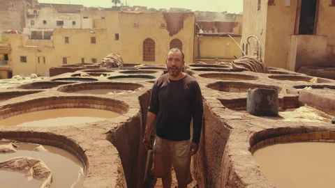 Moroccan tannery Worker looking at camera Stock Footage 271302341