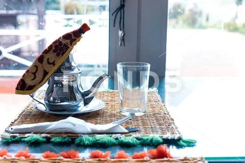 Moroccan tea with mint and sugar in a glasses on a copper plate with kettle Stock Photos