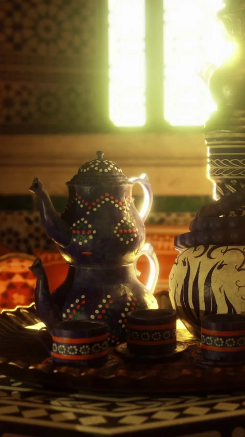 Moroccan tea set on a table with sunlight shining through a window Stock Footage 331769605