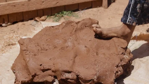 Moroccan worker fixing his clay dough Stock Footage 124592169
