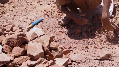 Moroccan worker hitting raw clay  Stock Footage 124589246