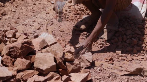 Moroccan worker hitting raw clay  Stock Footage 124589274