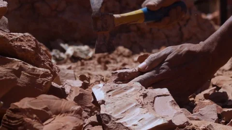 Moroccan worker hitting raw clay  Stock Footage 124589370