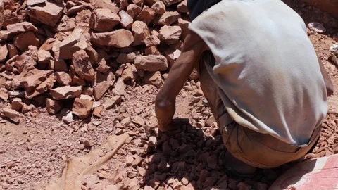 Moroccan worker hitting raw clay  Stock Footage 124589682