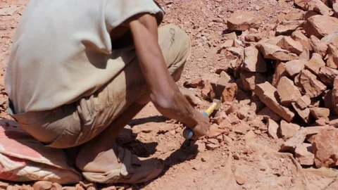 Moroccan worker hitting raw clay  Stock Footage 124589769
