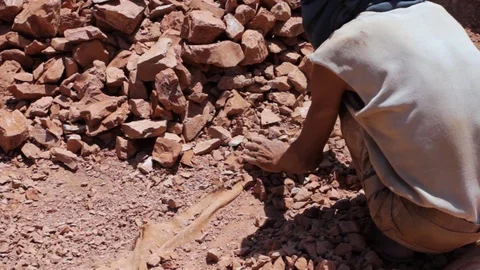 Moroccan worker hitting raw clay  Stock Footage 124589798