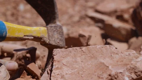 Moroccan worker hitting raw clay  Stock Footage 124589978