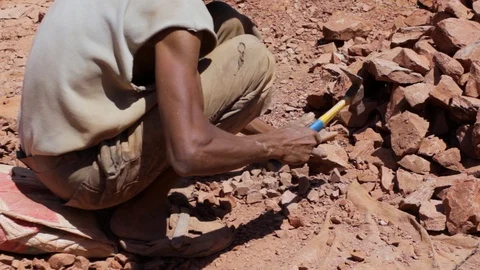 Moroccan worker hitting raw clay  Stock Footage 124589985