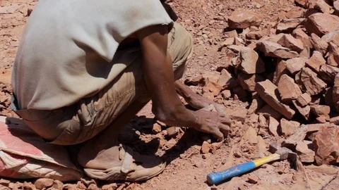 Moroccan worker hitting raw clay  Stock Footage 124590031