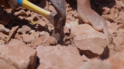 Moroccan worker hitting raw clay  Stock Footage 124590040