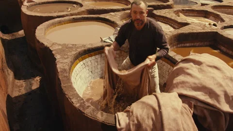 A Moroccan Worker Soaking Traditional Leather Stock Footage 271311466