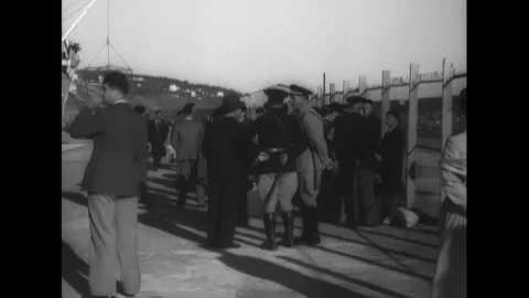 MOROCCO - 1930s - Officials inspecting documents and passengers at a port. They Stock Footage 340571670