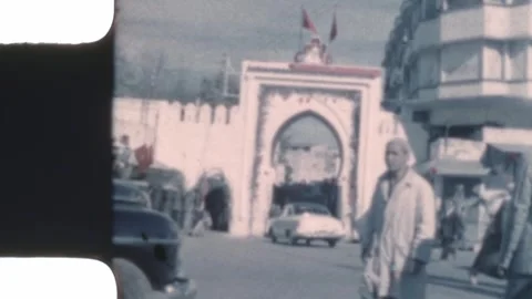 Morocco 1956, Grand Socco gate in Tangier with people walking Stock Footage 317533596