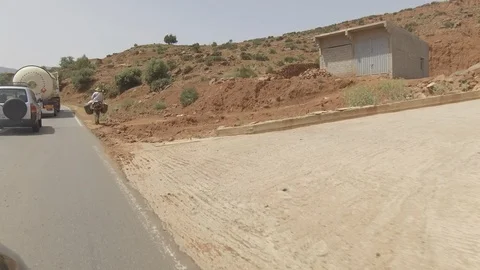 Morocco camera car establishing, Man rideing a donkey, Africa in 4K Stock Footage 91790848
