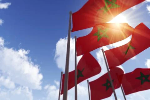 Morocco flags waving in the wind against a blue sky. 3D Rendering Illustrazione stock