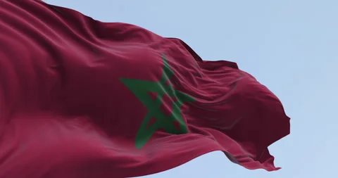 Morocco national flag waving in the wind on a clear day 스톡 동영상 335690451