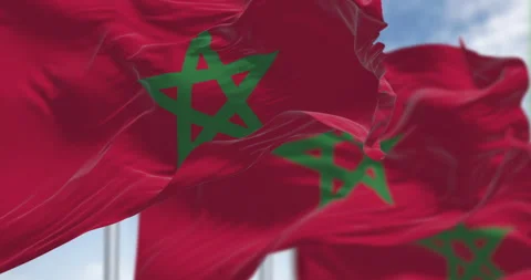 Morocco national flags waving in the wind on a clear day Stock Footage 310740402