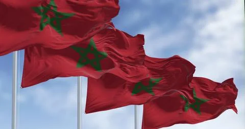 Morocco national flags waving in the wind on a clear day Stock Illustration