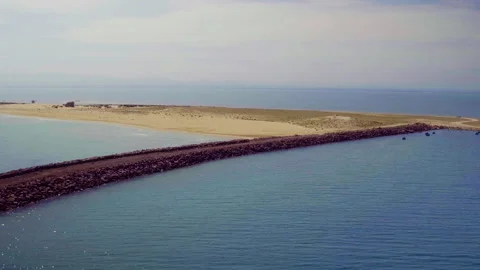 Morocco Sandy Spit Breakwater Lagoon Aerial Approach Stock Footage 336573496