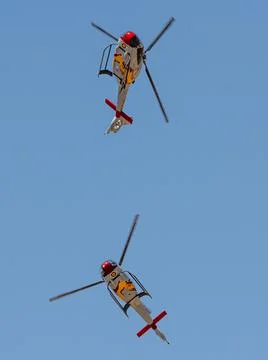 Moron, Spain - 12 May 23: Patrulla ASPA Helicopters performing aerial maneuve Stock Photos