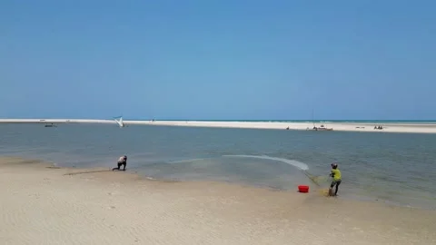 Morondava Beach, Catching fish in a net, Madagascar 4K video footage Stock Footage 226484801