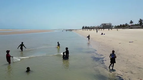 Morondava Beach, Catching fish in a net, Madagascar 4K video footage Stock Footage 226544931