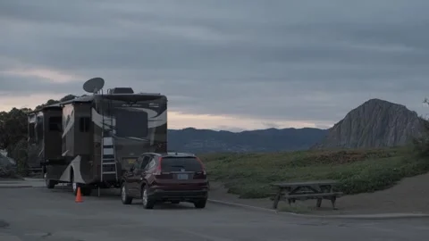 MORRO BAY, CA - DECEMBER 10, 2022 - RVs parked at campground near beach Stock Footage 345146386