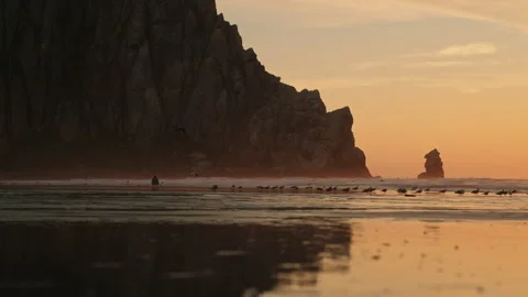 Morro bay rock reflection in the water at sunset over the Pacific Ocean on the Stock-Footage 347673972