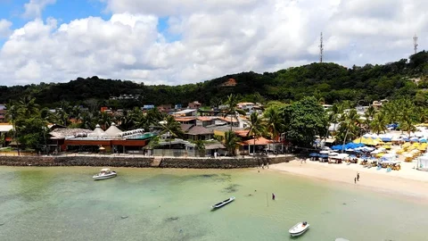 Morro de Sao Paulo Third Beach Shore. People walking in front of clear water Stock Footage 126058285