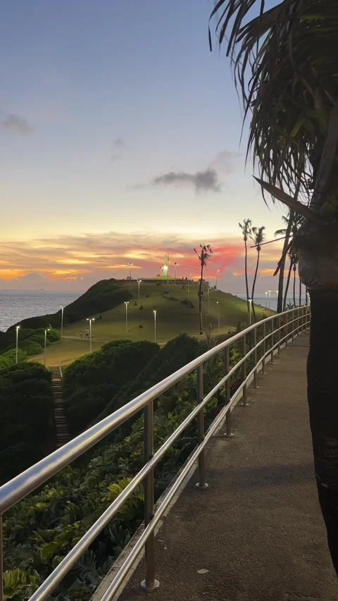 Morro do Cristo Hill View from Coastal Walkway at Sunset in Salvador Stockbeeldmateriaal 343440915