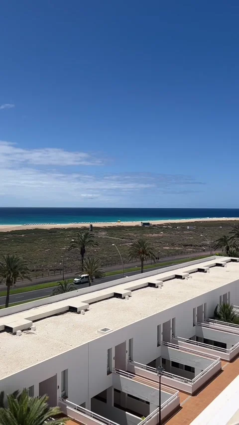 Morro Jable lighthouse ocean view hotel resort pan Fuerteventura HD vertical Stock Footage 342027775