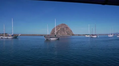 Morro Rock with boats Stock Footage