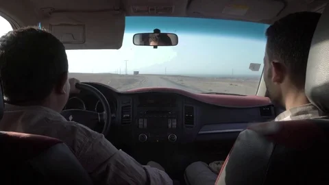 Morrocan men driving through the desert 4K 스톡 동영상 70311765