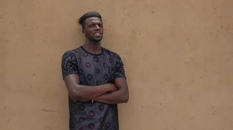 Morrocan modern young man portrait against wall 2 Stock Footage 50239685