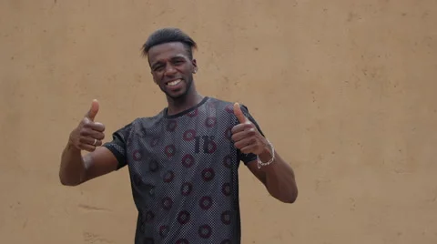 Morrocan modern young man thumbs up portrait Stock Footage 50239879