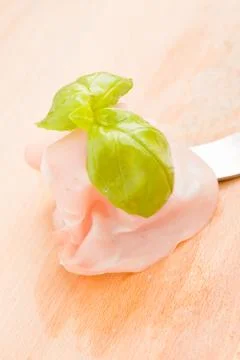 Mortadella with basil Stock Photos