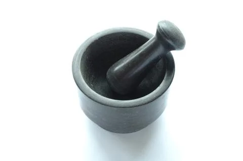 Mortar and pestle on white background Stock Photos