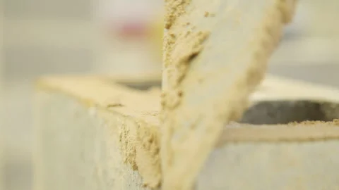 Mortar being applied on to a  brick 4k Stock Footage 282630784