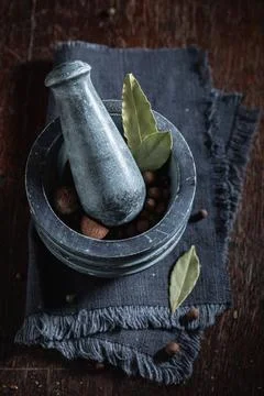 Mortar full of herbs. Basic herbs for stews. Stock Photos