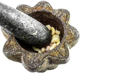 Mortar with garlic on white background Stock-Fotos